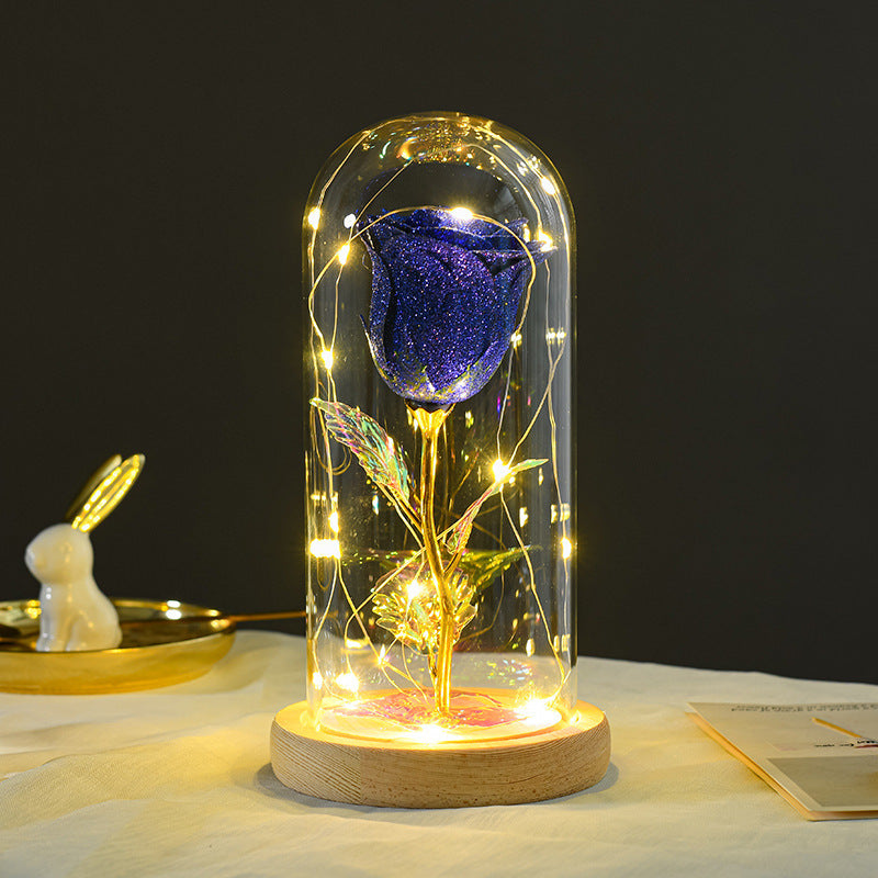 Purple-blue eternal rose glowing with LED fairy lights