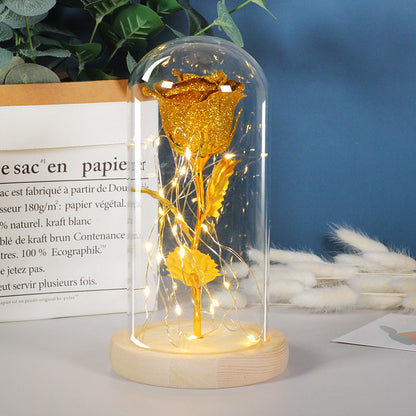 Gold eternal rose in glass dome